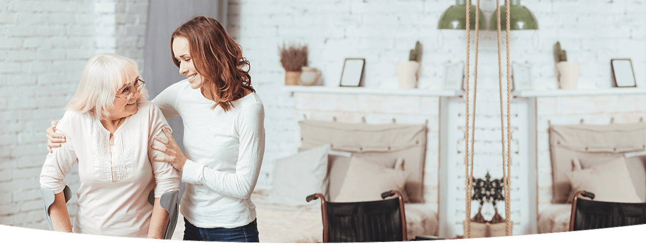 Caregiver supporting an older adult at home